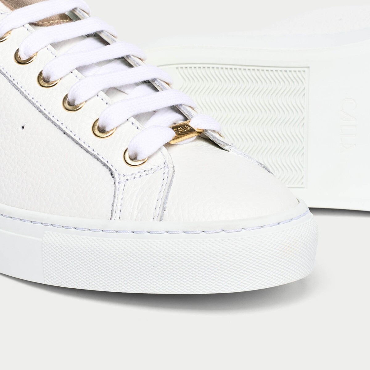 Star - Grain White Leather & Champagne Wide Fit Trainers by Calla Shoes.